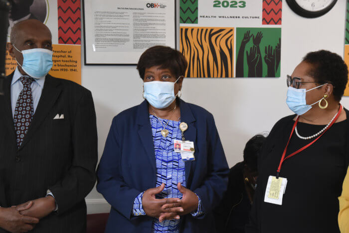 three doctors in masks at contraceptive care clinic 