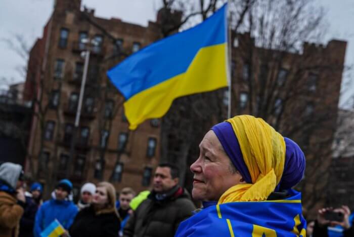 woman waving ukrainian flag 