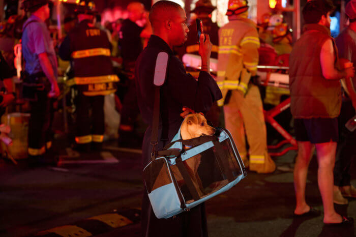 person standing outside after residential fire