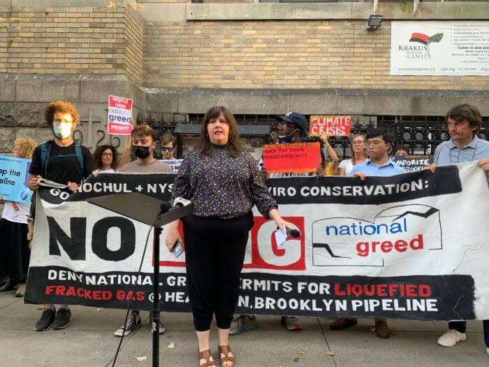 assembly member emily gallagher speaks at a rally