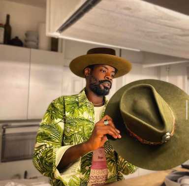 Rich Faison poses with his unique hats.