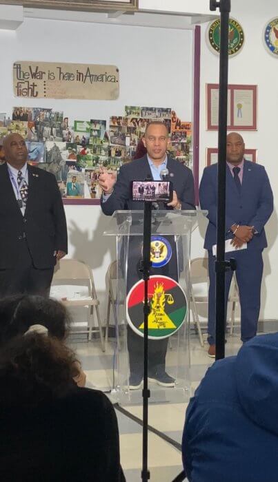Rep. Hakeem Jeffries stands at a podium announcing the allocation of $1 million in funding to the Black Veterans for Social Justice organization.