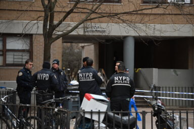 Police canvas the scene of the double shooting in Williamsburg.