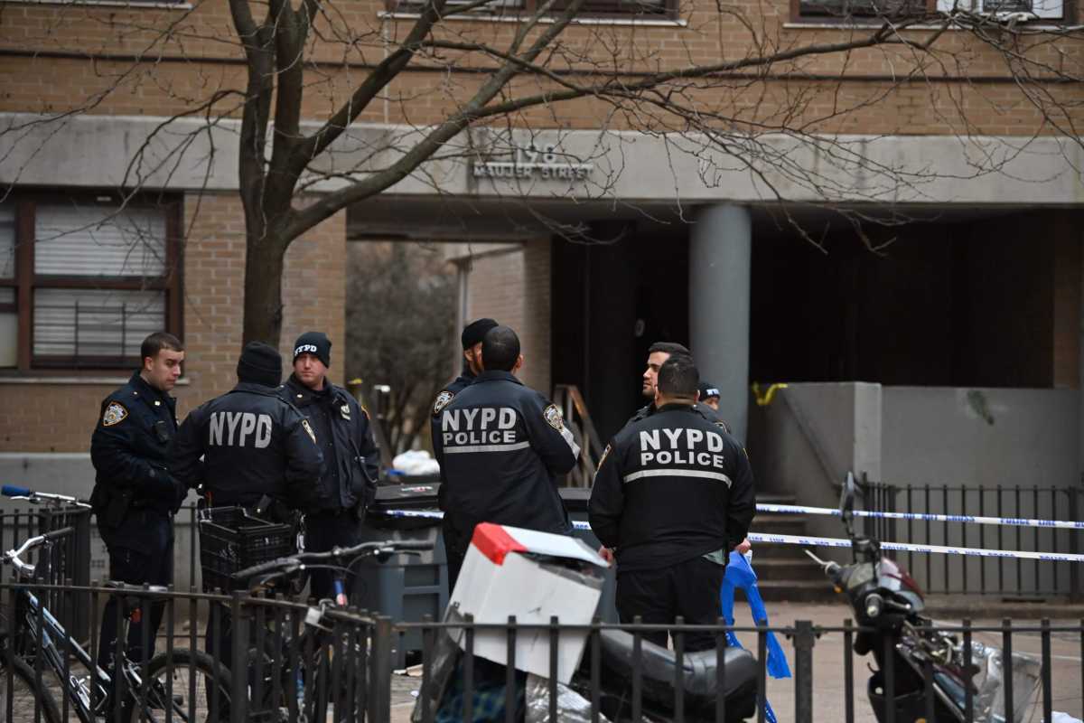 Police canvas the scene of the double shooting in Williamsburg.