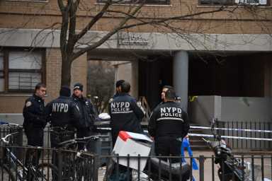 Police canvas the scene of the double shooting in Williamsburg.