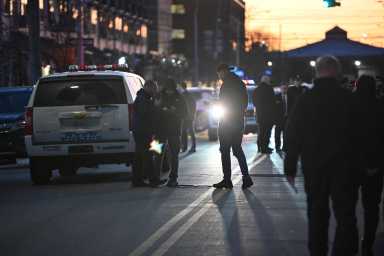 Police investigate the scene near 3222 Mermaid Ave in Coney Island on Friday.