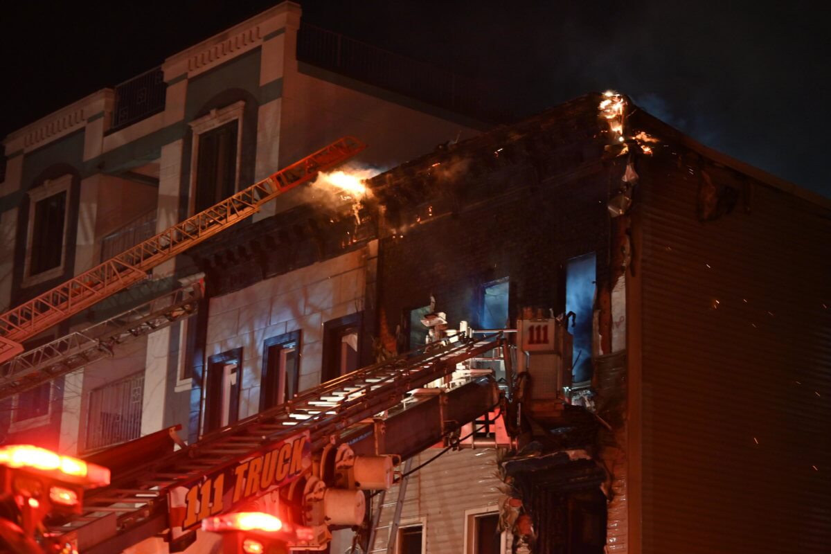 Firefighters battle the blaze at 14 Goodwin Place.