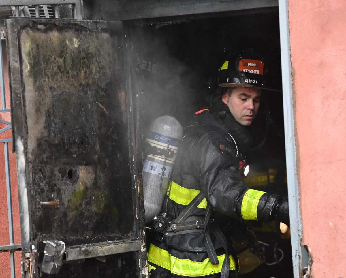 Firefighters battle the blaze at 19 Throop Avenue in Williamsburg.