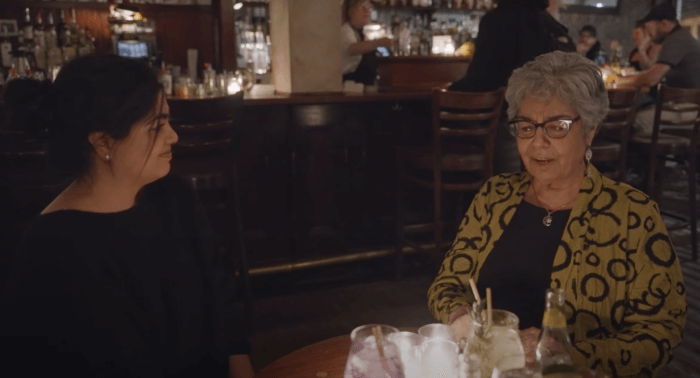 two guests talking on bar talk