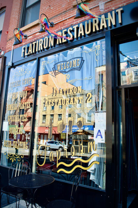 Image of the front door of the Flatiron Steakhouse restaurant in Park Slope.