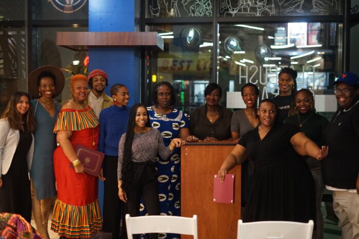 Members of Mangrove's Community Based Academy gather for informative session.