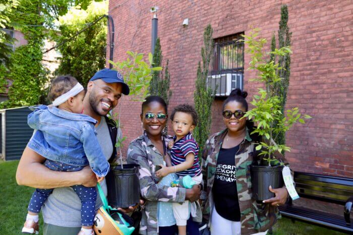 New York family receives free trees to plant in their neighborhood.