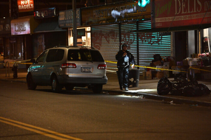 Police search for evidence at the scene in Sheepshead Bay. 