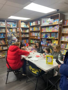 kids do dr. seuss day crafts in bookshop