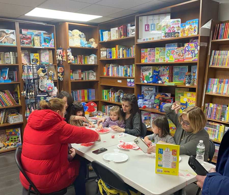 kids do dr. seuss day crafts in bookshop