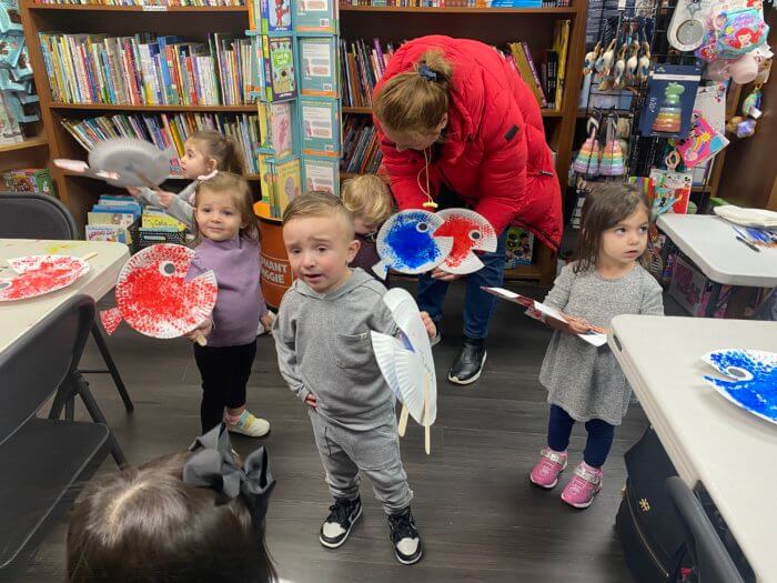 kids doing dr. seuss day crafts at bookmark shoppe 
