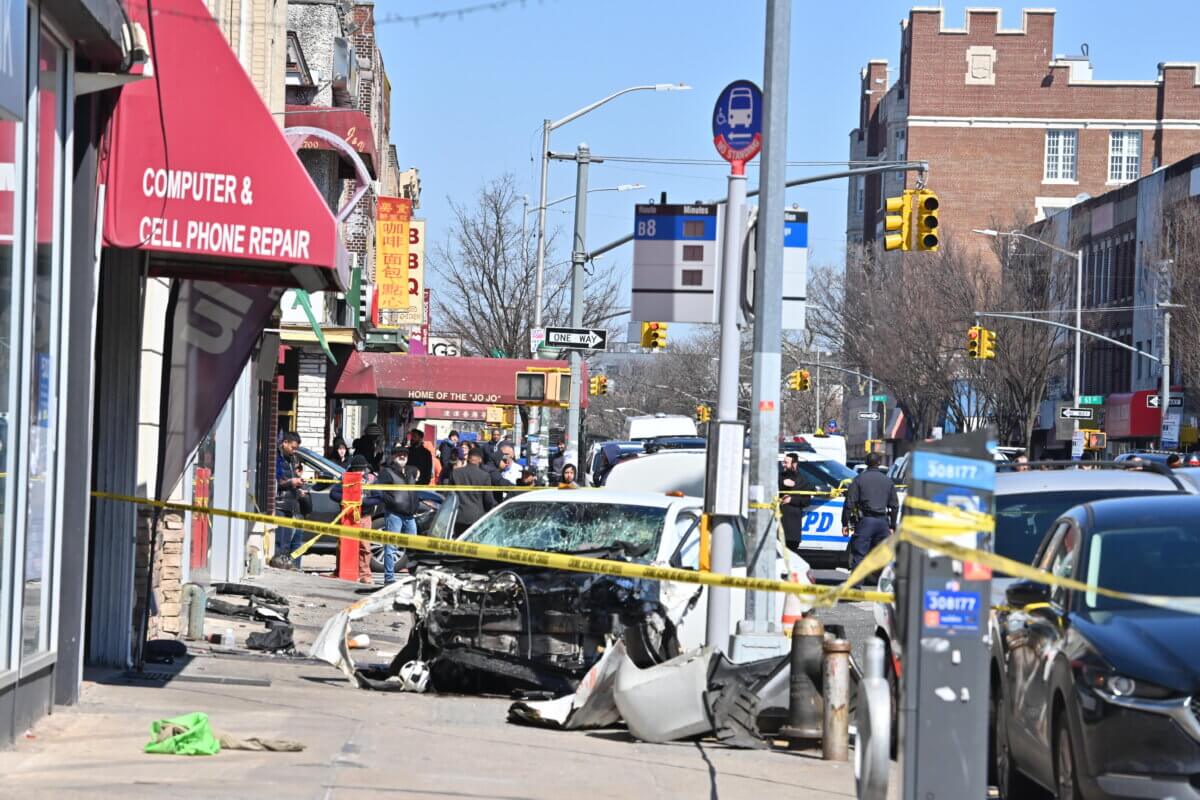 One car involved in the crash ended up totaled on the sidewalk near a bus stop in Bensonhurst.