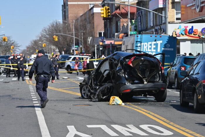 The black hatchback was left destroyed in the middle of 18th Avenue in Bensonhurst.