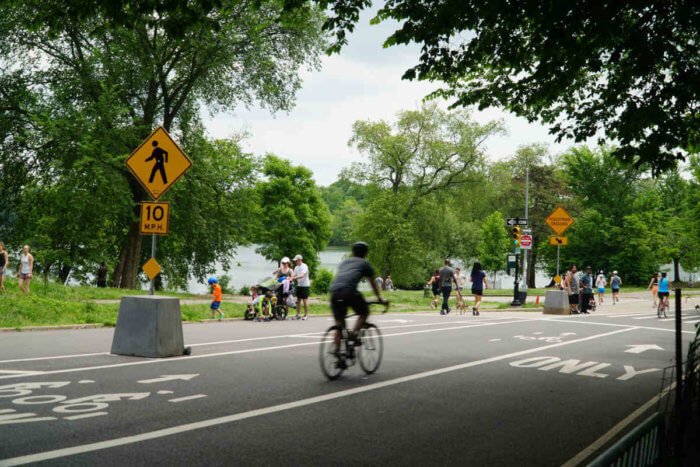 Bikers and pedestrians on Prospect Park Drive in Brooklyn.