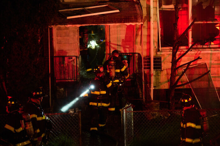 Firefighters were withdrawn from the building during the four-alarm blaze.