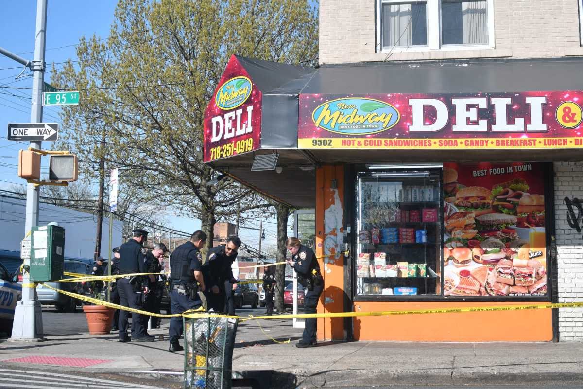 Police investigate the scene where a gunman fatally shot a man in Canarsie.