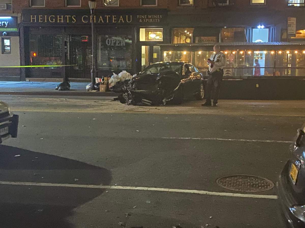 The car that delivered the fatal blow to the pedestrian on Atlantic Avenue was severely damaged in the incident.