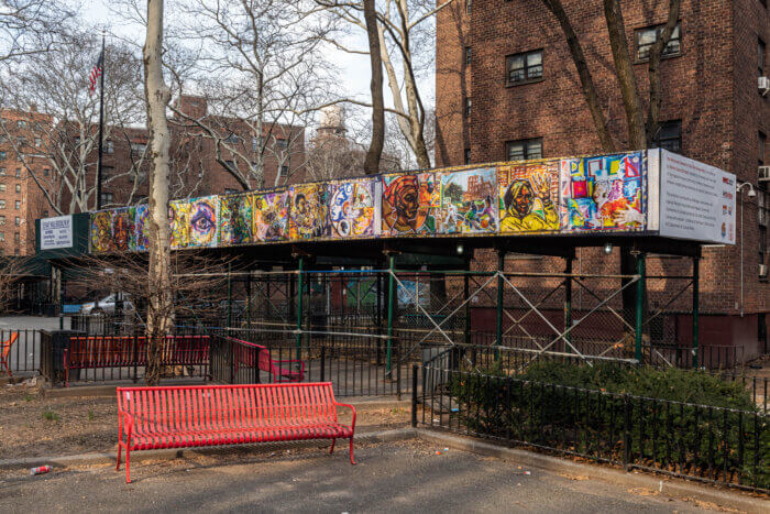bridging the divide painting on sidewalk shed