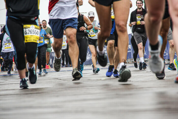 Blood, sweat and rain. Runners pounded the pavement all the to the end.