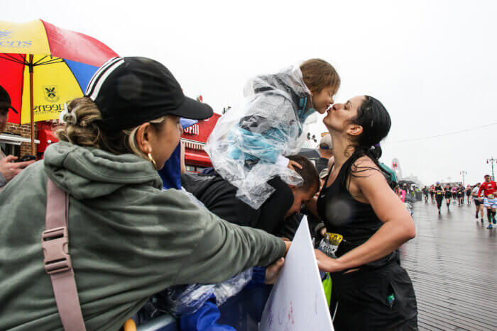 Natalie Wesley reunites with family moments before crossing the finish line. 