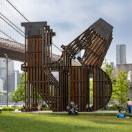 Nicholas Galanin's sculpture in Brooklyn Bridge Park, titled 'In every language there is Land / En cada lengua hay una Tierra.'