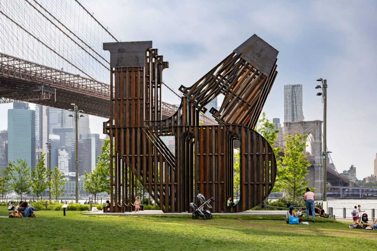 Nicholas Galanin's sculpture in Brooklyn Bridge Park, titled 'In every language there is Land / En cada lengua hay una Tierra.'