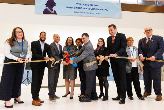Members of South Brooklyn Health and elected officials cut the ribbon on Ruth Bader Ginsburg Hospital.