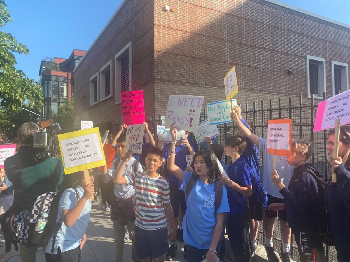 Parents rallied in Williamsburg against the housing of migrants at the P.S. 17 and M.S. 577 school building gym.