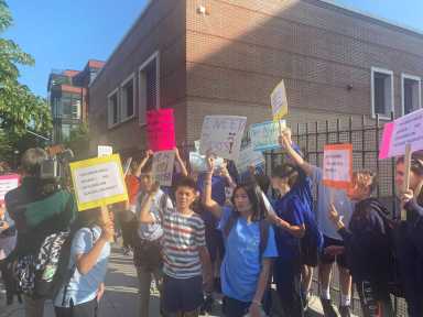 Parents rallied in Williamsburg against the housing of migrants at the P.S. 17 and M.S. 577 school building gym.