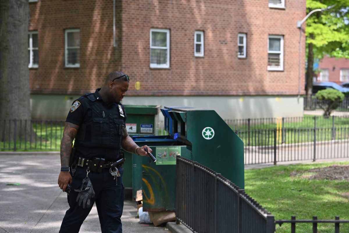 Police inspect the scene of the shooting in Canarsie.