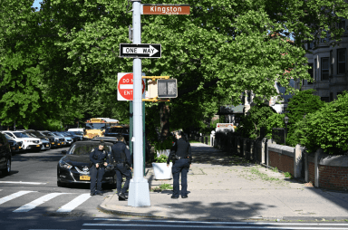 Police case the scene of the shooting in Crown Heights.