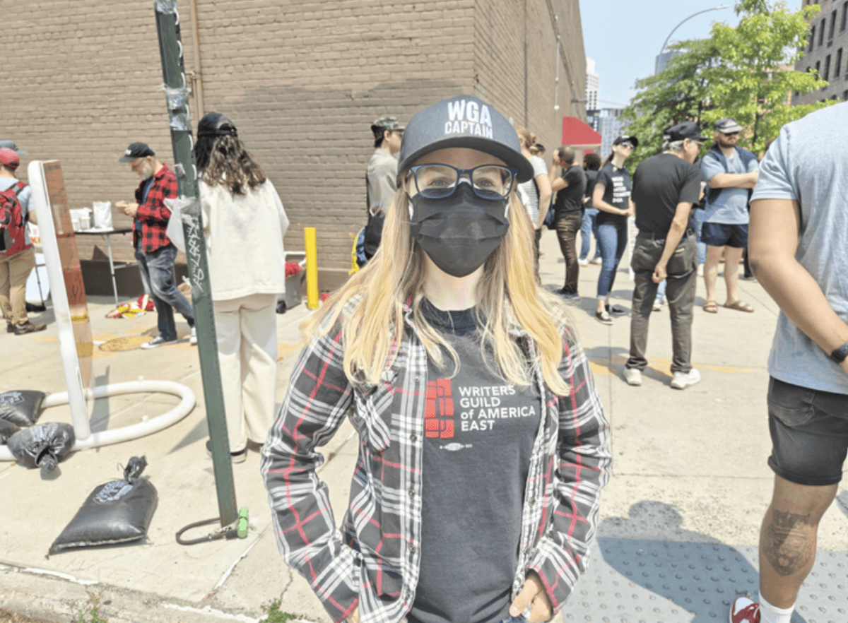 Television writer Sasha Stuart protests in Greenpoint as part of the strike.