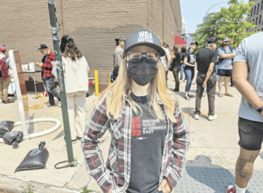 Television writer Sasha Stuart protests in Greenpoint as part of the strike.