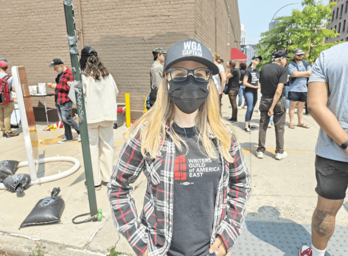 Television writer Sasha Stuart protests in Greenpoint as part of the strike.