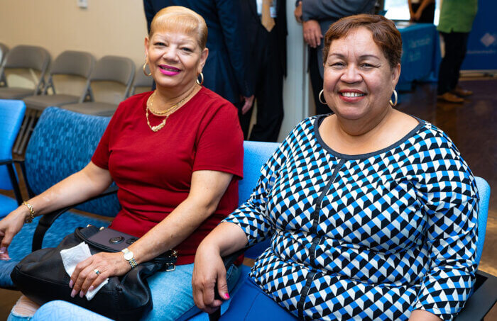 Grisel Amador poses with a smile at the health centers town hall.