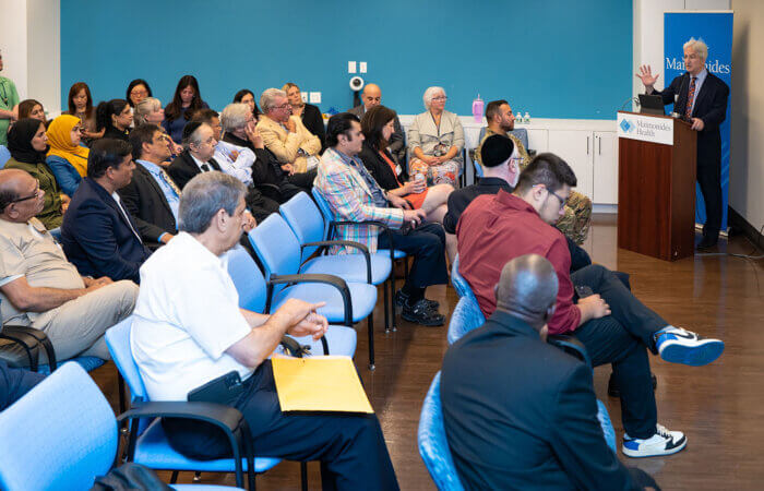 Representatives from various organizations in Borough Park meet for an annual community engagement event on June 20.