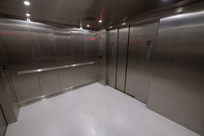 The new elevators completely replaced the older system that was over 50 years old.