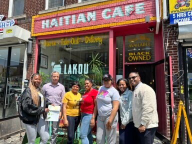 people pose outside lakou cafe in crown heights