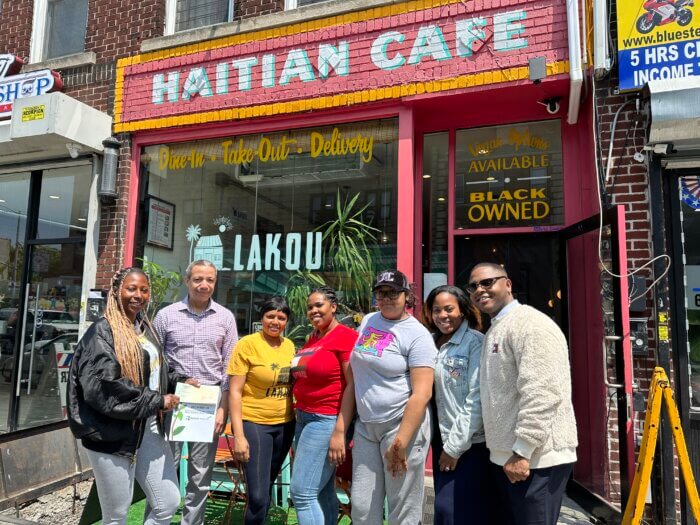 people pose outside lakou cafe in crown heights