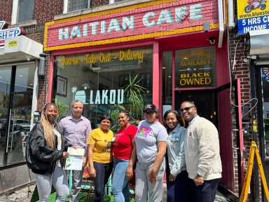 people pose outside lakou cafe in crown heights
