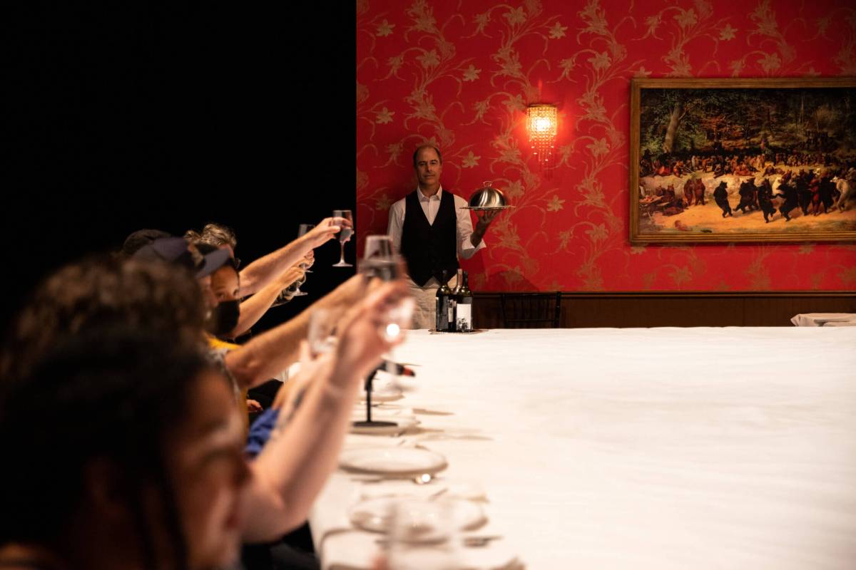 Performer and theater artist Geoff Sobelle serves the audience at a dinner party unlike any other at this year festival