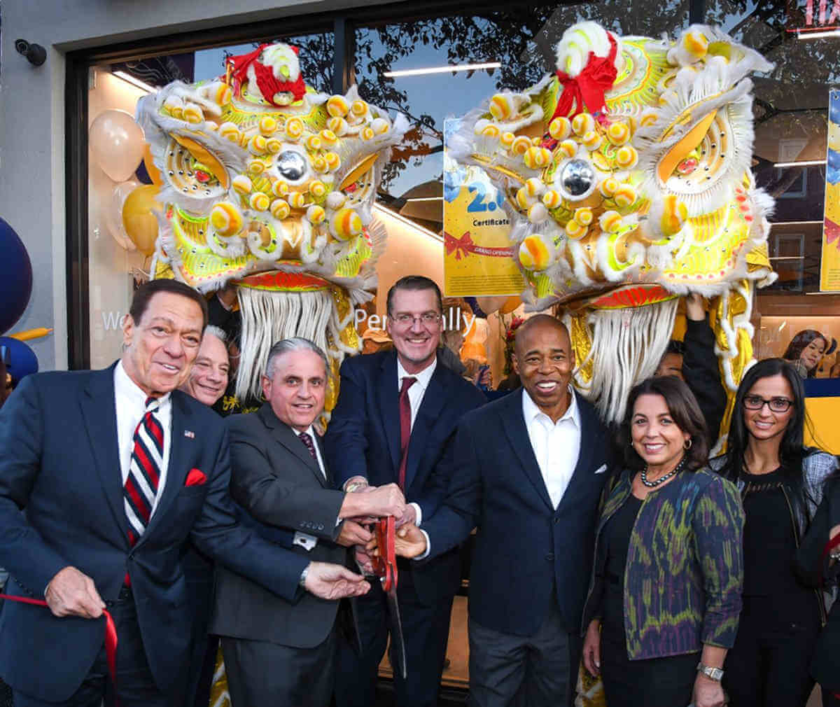 Bankers at Empire State Bank photographed with NYC Mayor Eric Adams