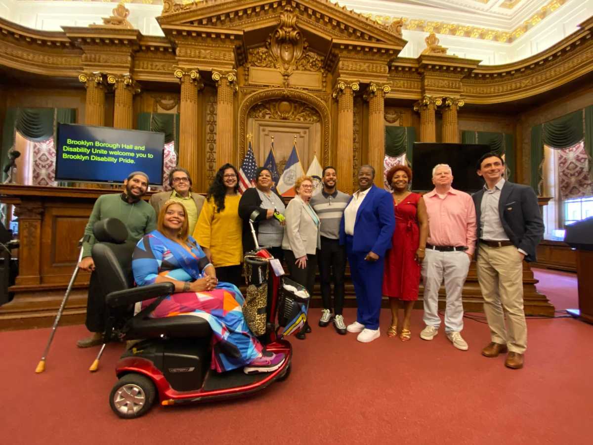 antonio reynoso with speakers at disability pride event