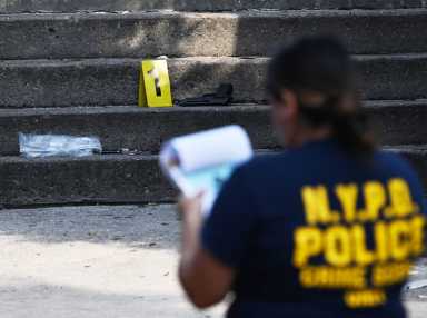 officer outside bedford-stuyvesant building