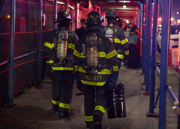 firefighters remove lithium-ion battery from starrett city fire